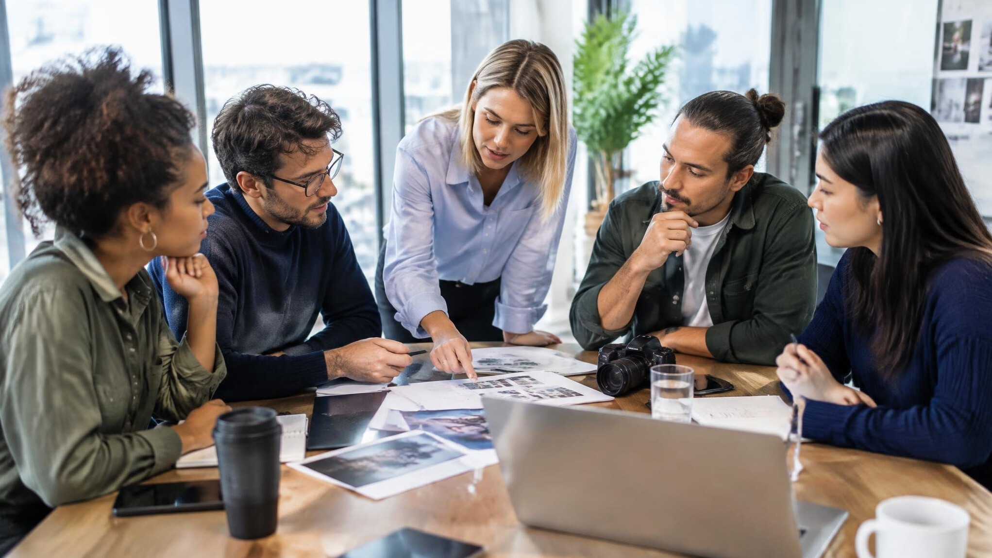 Diverse team of media professionals discussing in a meeting room